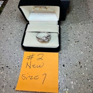 Brand new beautiful 925sterling silver/ white Saphire stone size 7 ring. Ring #2